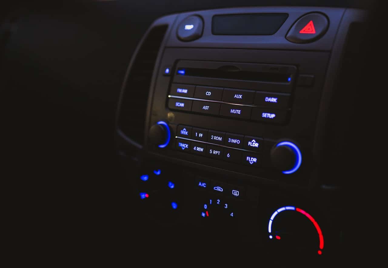 Closeup of a car radio and control panel at night before a car accident