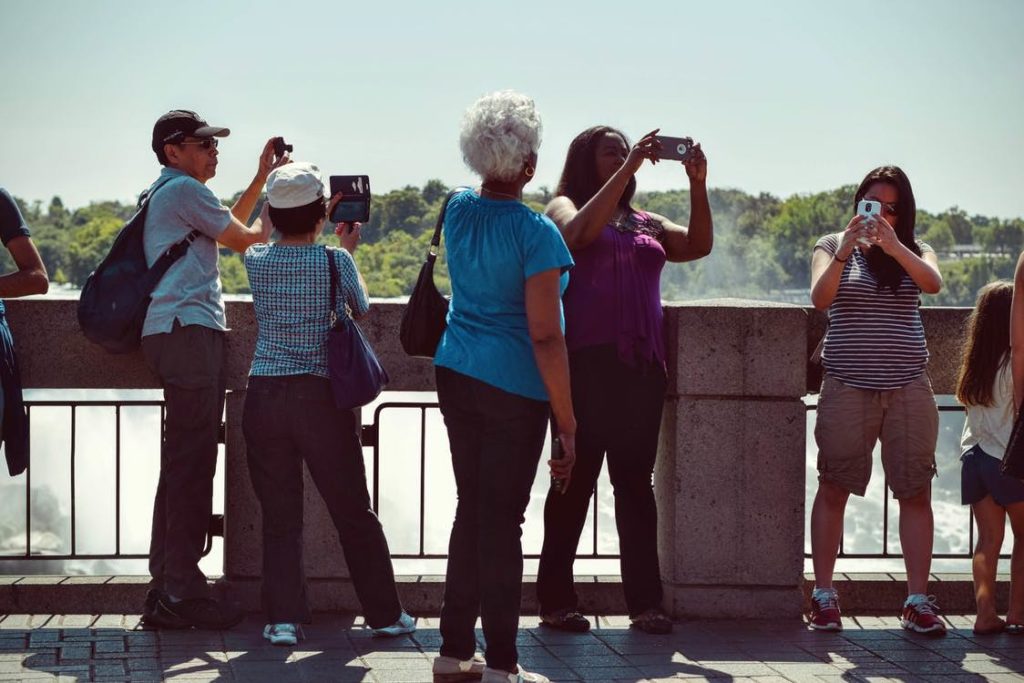 Tourists taking photos from a Florida bridge