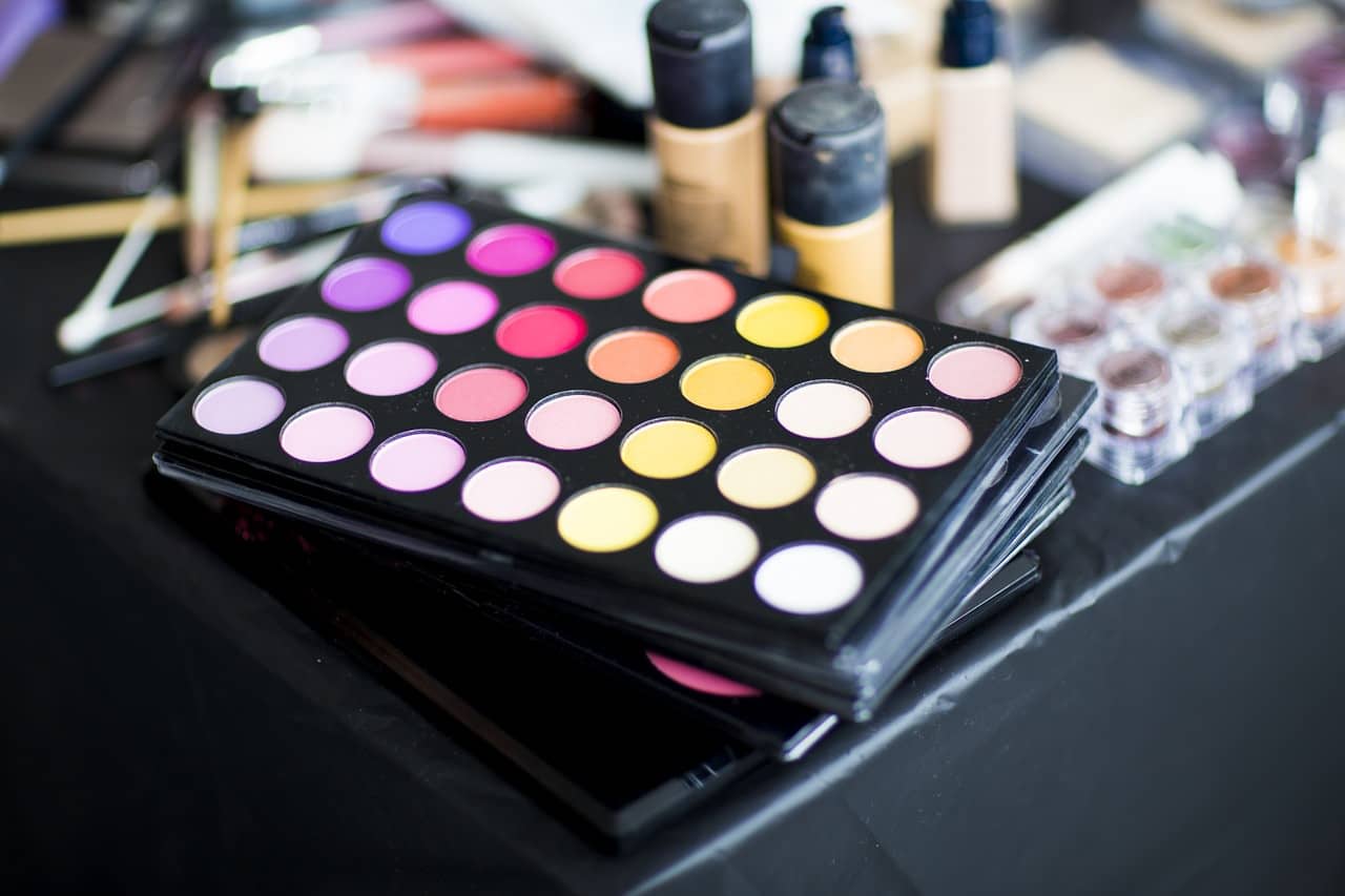 Closeup photo of makeup products on the console of a car