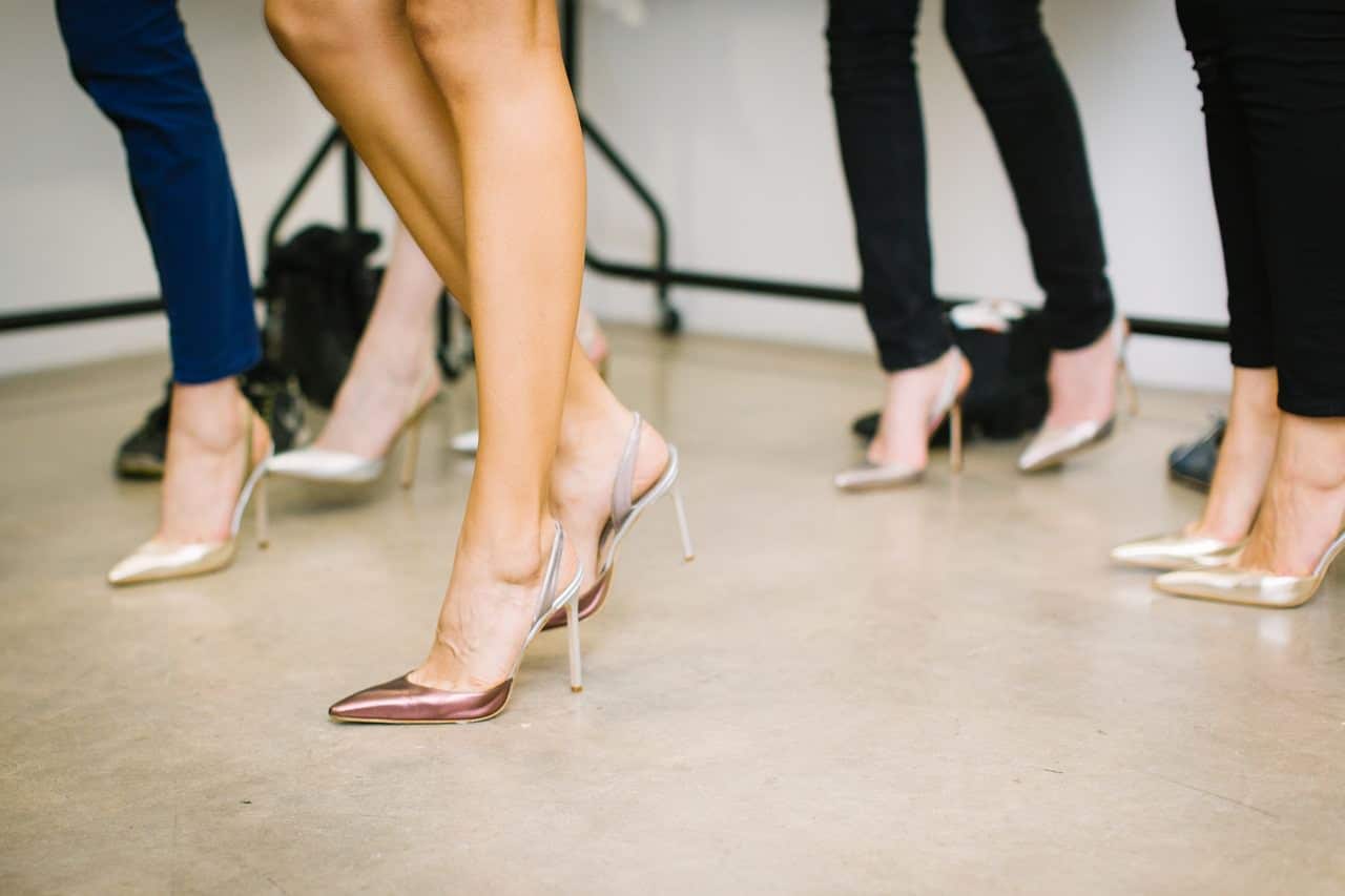 View of several women in stiletto high heels standing together
